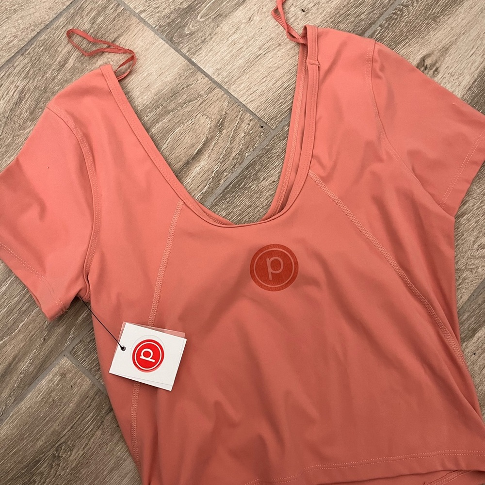 Pure barre NWT top sports Pilates barre 
Logo